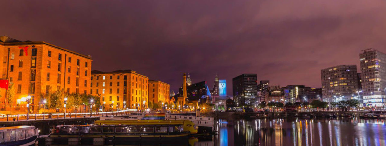 Image showing a nighttime scene in a city with views over the canal
