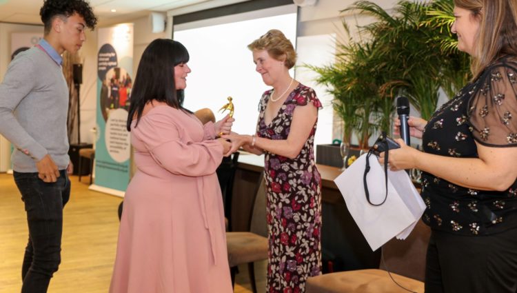 Outstanding Volunteer Award presented to Wayne Jordan's daughter Kerrie.