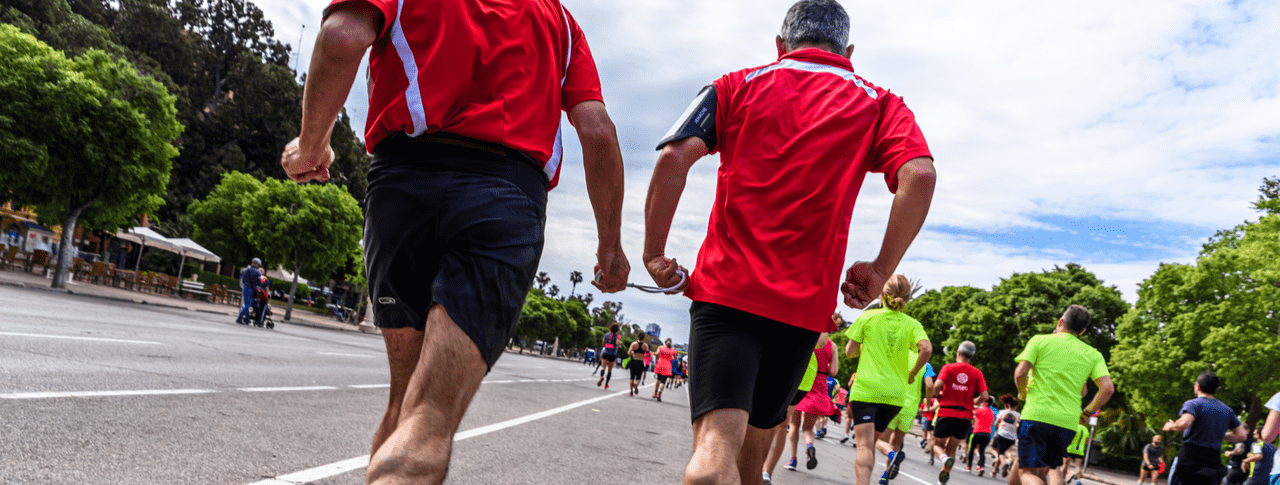 blind runner running a guide