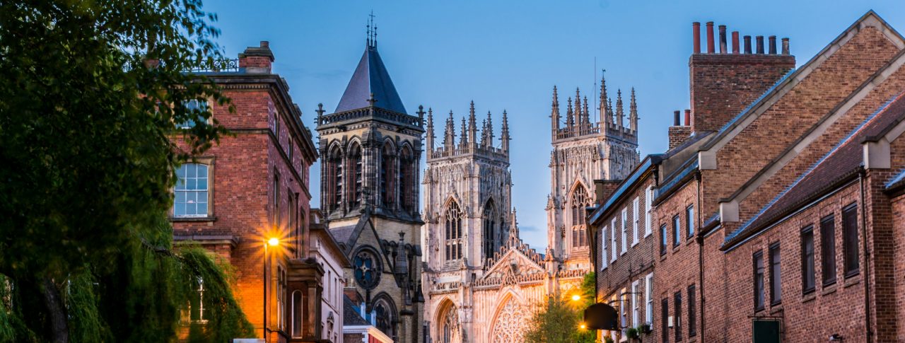 York Sight Loss Council image showing city streets at dusk with York Minster in the background
