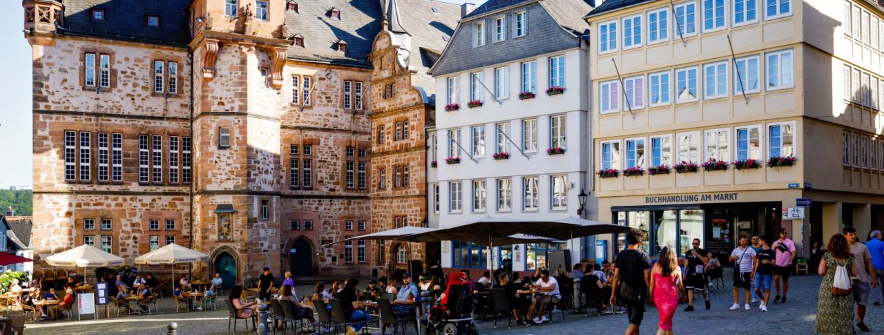 Cityscape of the German city of Marburg with historical townhall and market place. City with cafes and restaurants