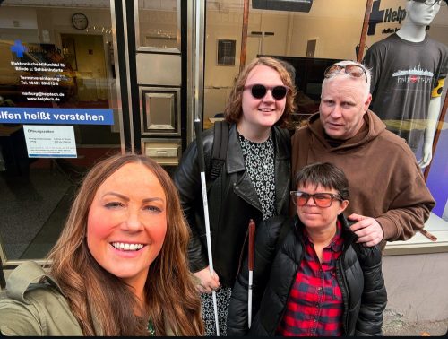 Rachel, Iain, Martha and Sydney doing a selfie outside the Tech Help shop, exploring the accessible town of Marburg.