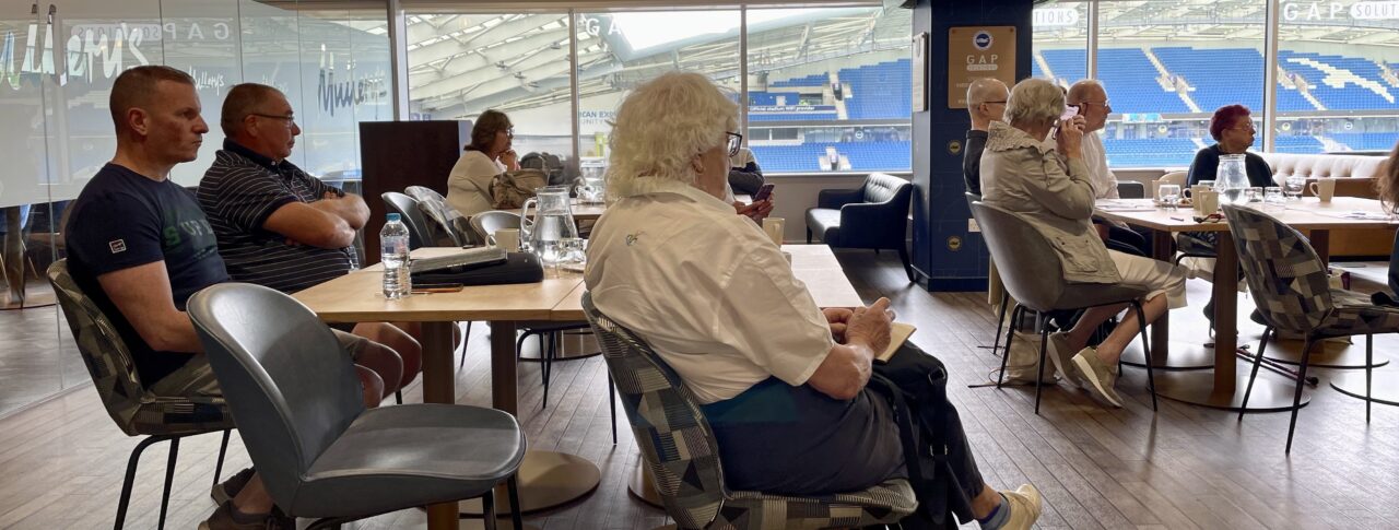 Audience members sat listening to one of the guest speakers at the Make Transport Accessible forum.