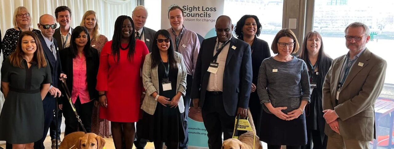 A large group photo comprised of volunteers and MPs at the Houses of Parliament.