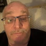 Selfie-style photo of Jack Shepherd, Northumberland and Cumbria Sight Loss Council member. He has short, light hair and a light moustache. He is wearing glassed and looking directly at the camera.