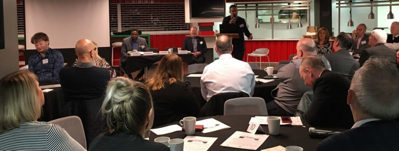 Man presenting to the audience at 'Bridge the Gap busting myths to increase diversity' conference