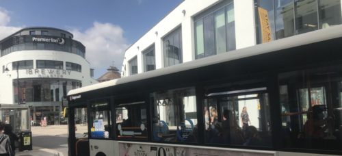 Image showing a bus at a bus stop in city center