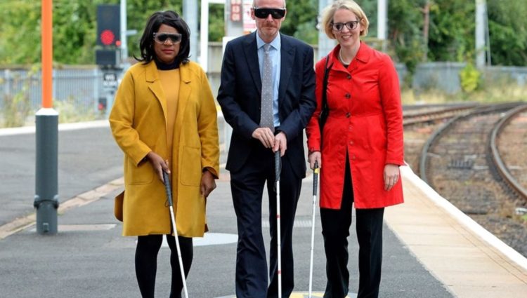 Image showing 3 people with walking sticks on the platform at Wolverhampton Train Station