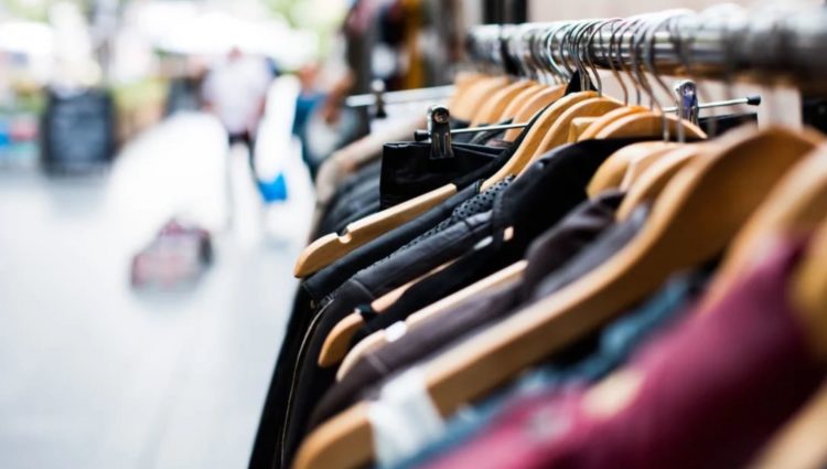 tops of hanging clothes on a shopping rail