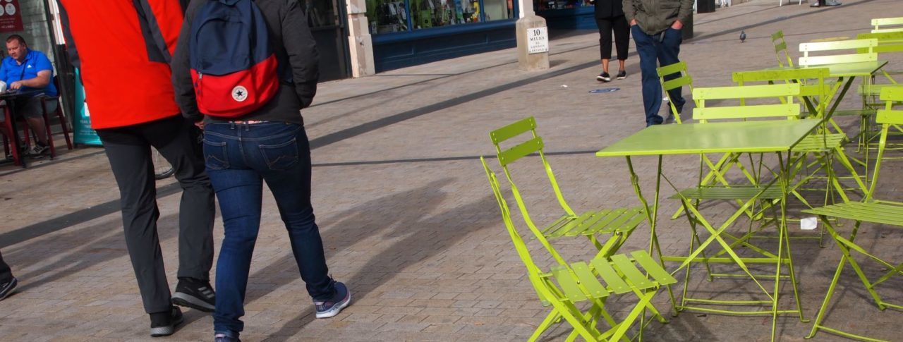 High Street scene with cafe chairs placed right across the pavement