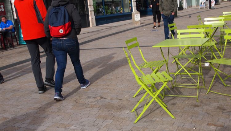 High Street scene with cafe chairs placed right across the pavement