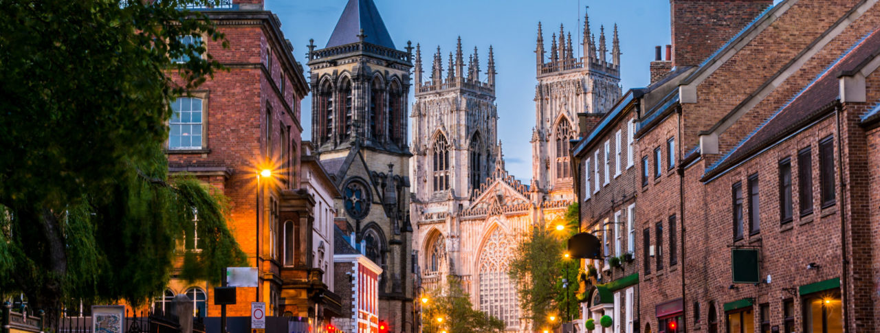 York Sight Loss Council image showing city streets at dusk with York Minster in the background