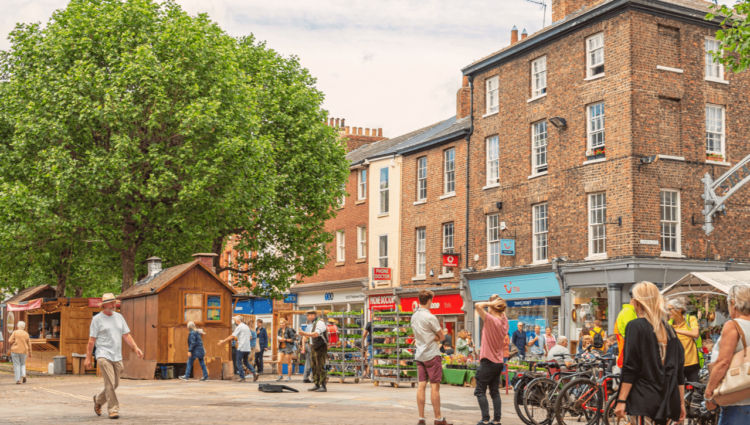 A busy pedestrianised road in York city centre