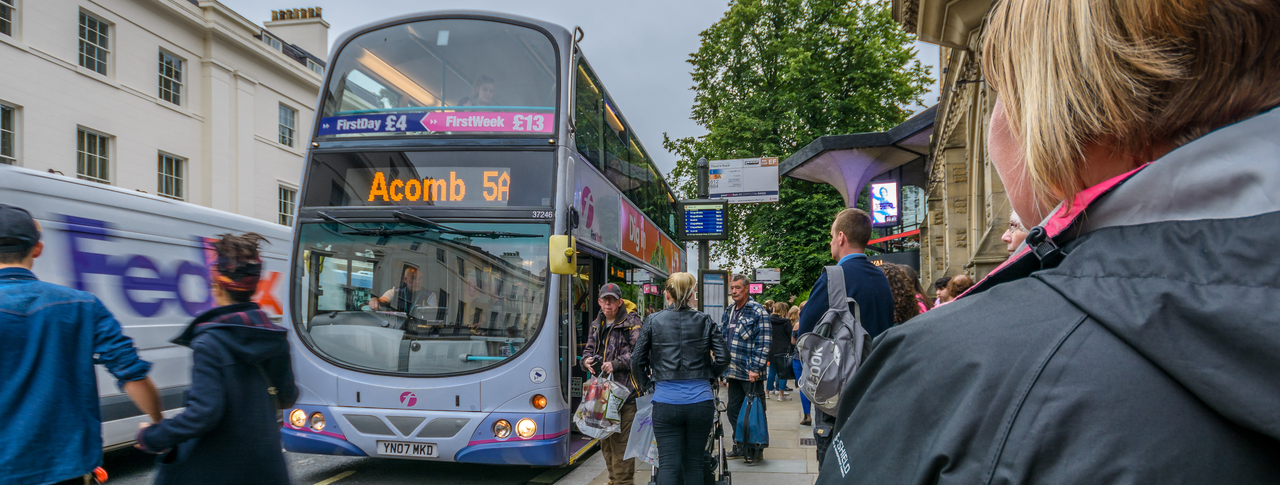 people getting on a bus in York