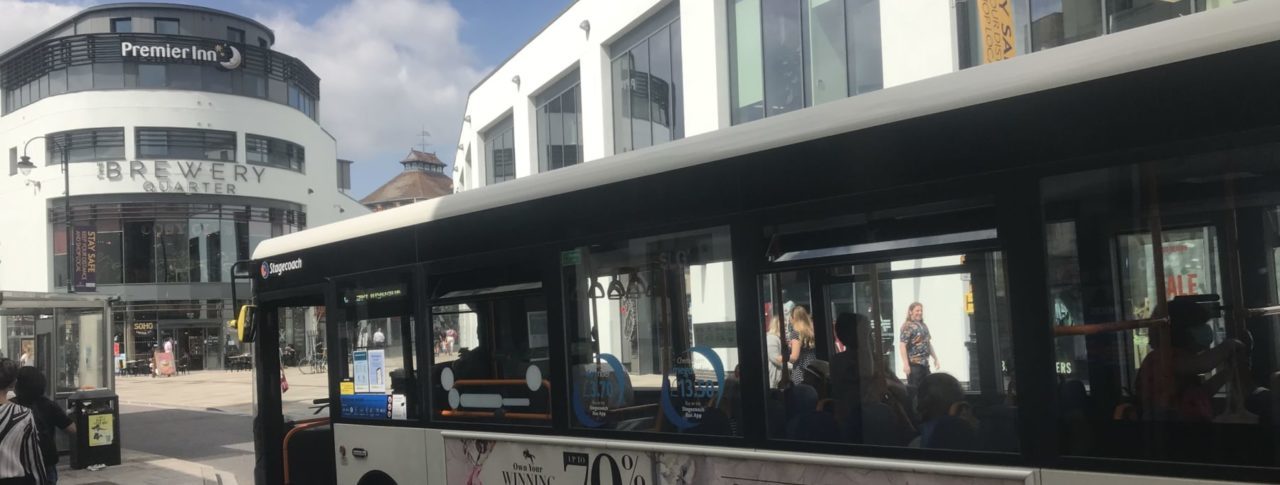 Image showing a bus at a bus stop in city center