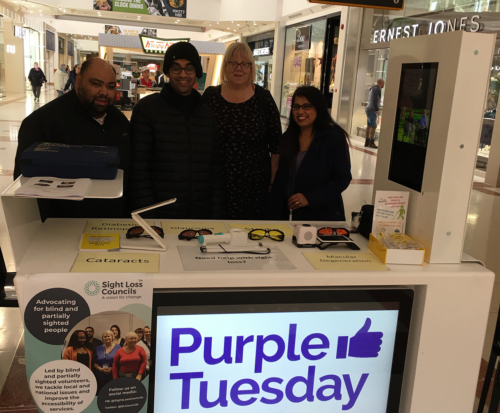 West Midlands SLC members posing at Purple Tuesday stand
