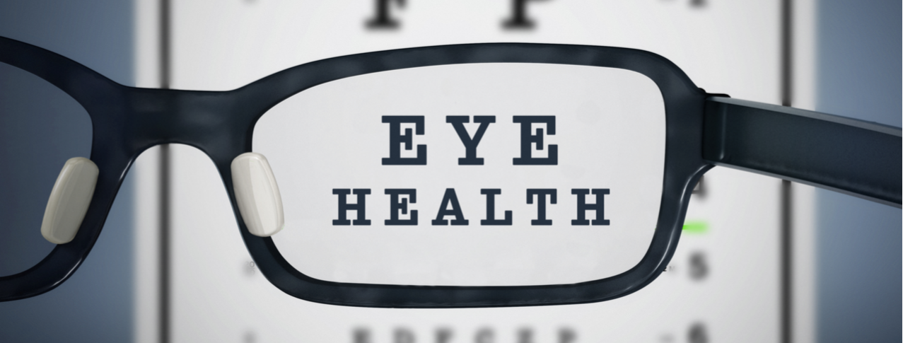 Eye test chart and eyeglasses. Letters spell 'eye health'