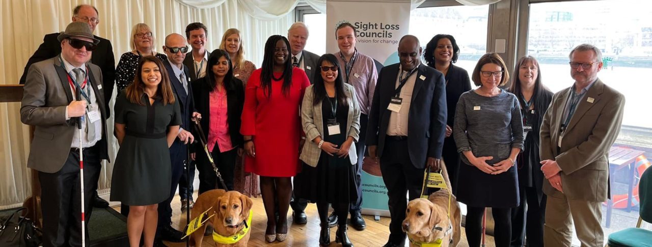 A large group photo comprised of volunteers and MPs at the Houses of Parliament.