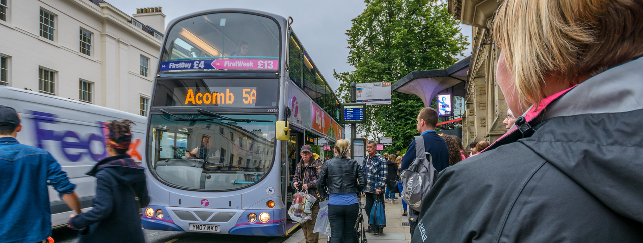 people getting on a bus in York