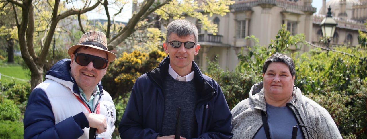 Photo of Dave Smith and two SLC members, Iris and Paul outside the Pavilion