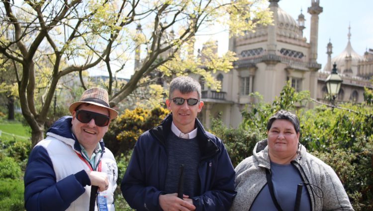 Photo of Dave Smith and two SLC members, Iris and Paul outside the Pavilion