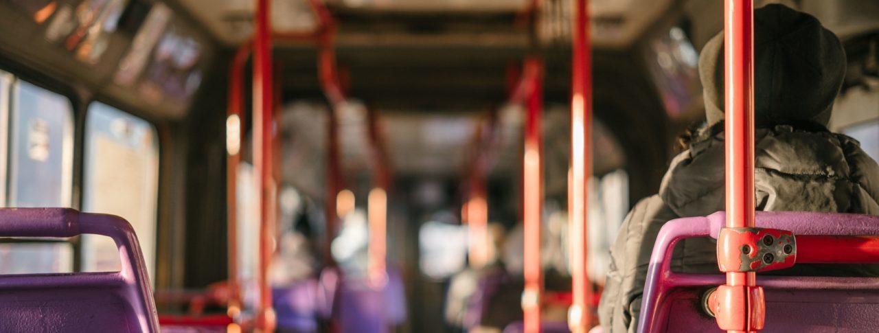 A person sits on a bus