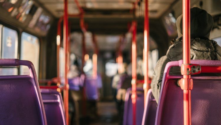 A person sits on a bus