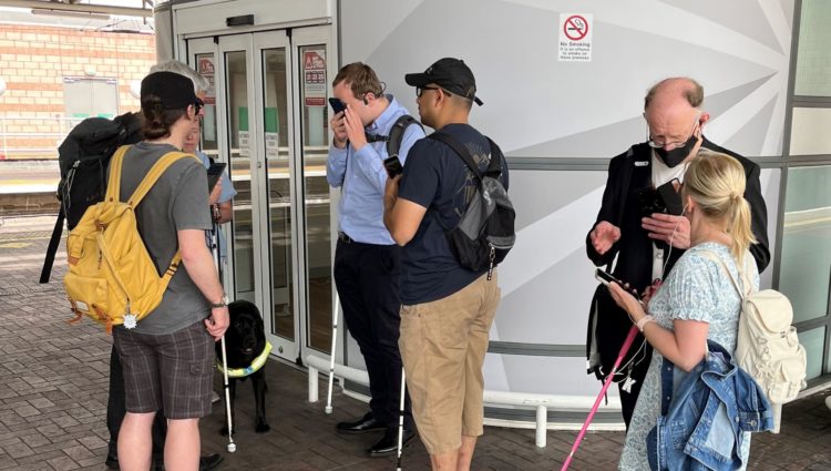 Blind and partially sighted Sight Loss Council members and Thomas Pocklington staff test out the new app at Manchester Airport Railway Station