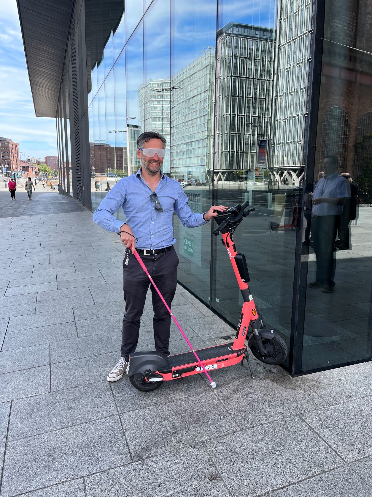 Voi staff trying sim specs at Liverpool e-scooter event Jun 22