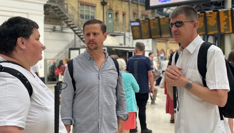 East Sussex Sight Loss Council member pictured with Engagement Manager Dave Smith at Brighton train station on a sim specs walk.
