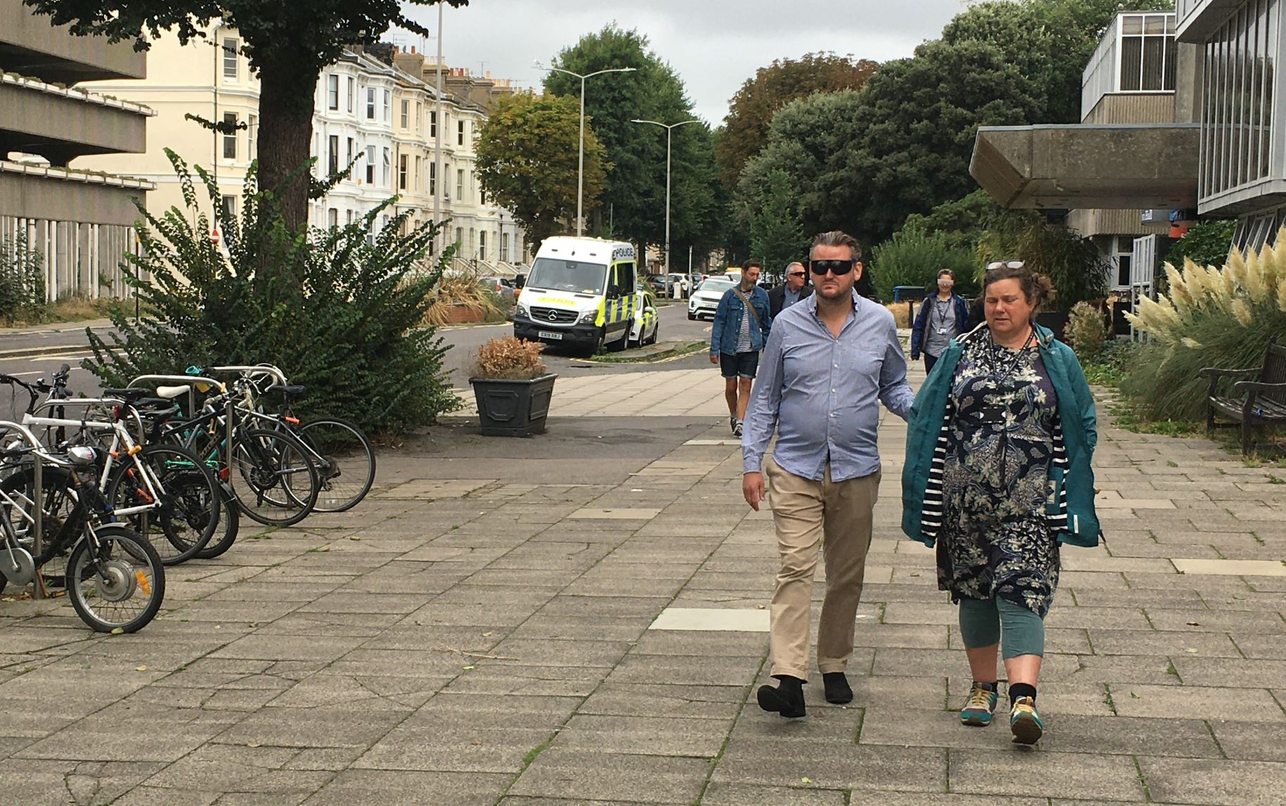 James Hammond wearing sim specs, being guided by Lesley Heath