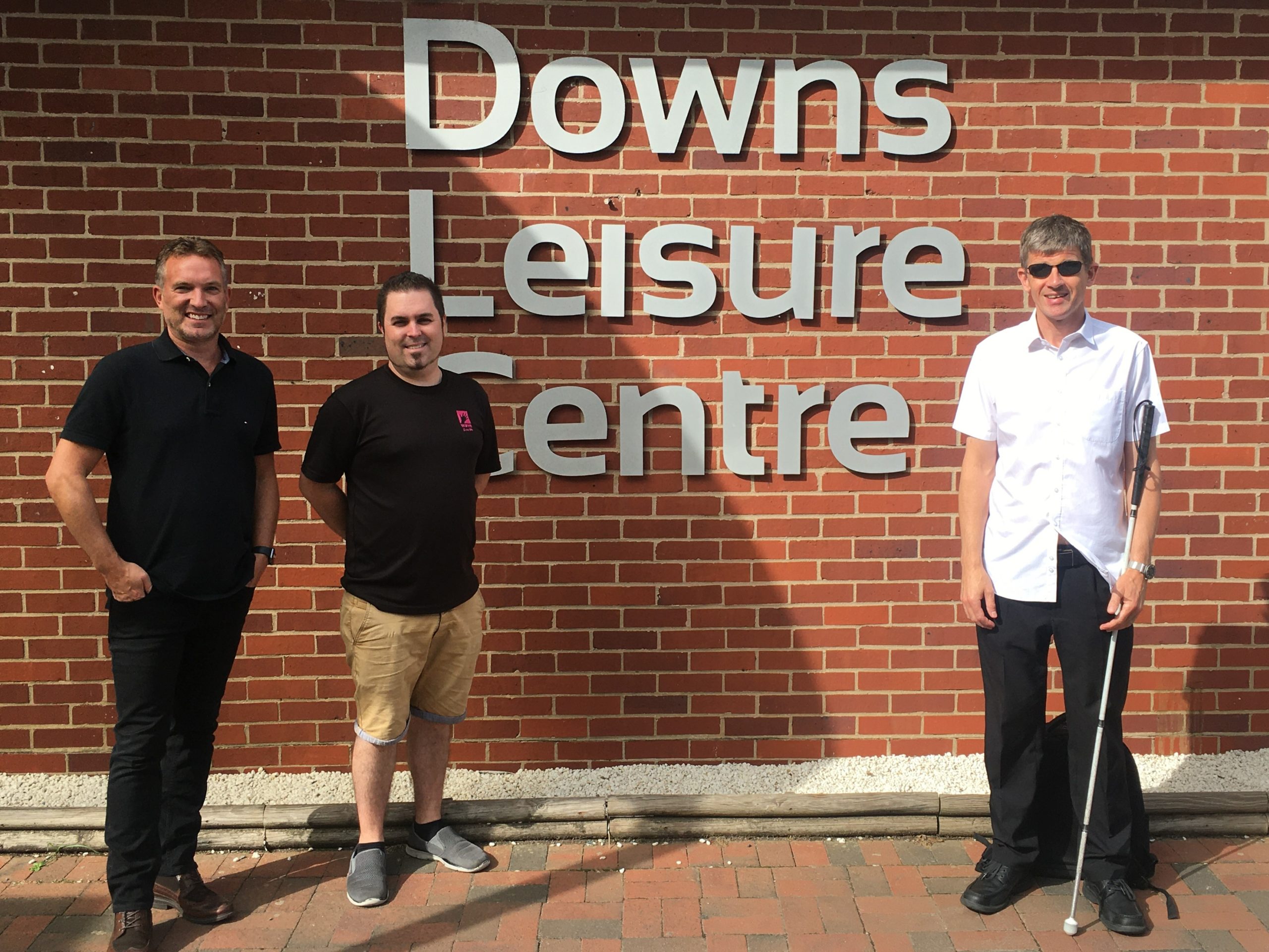 Image shows (left to right): Thomas Pocklington Trust’s Head of Sport and Leisure, Martin Symcox; Wave Leisure Trust’s Training Manager Andrew Grosvenor; and Dave Smith, South East SLC Engagement Manager. They are stood in front of the Downs Leisure Centre.