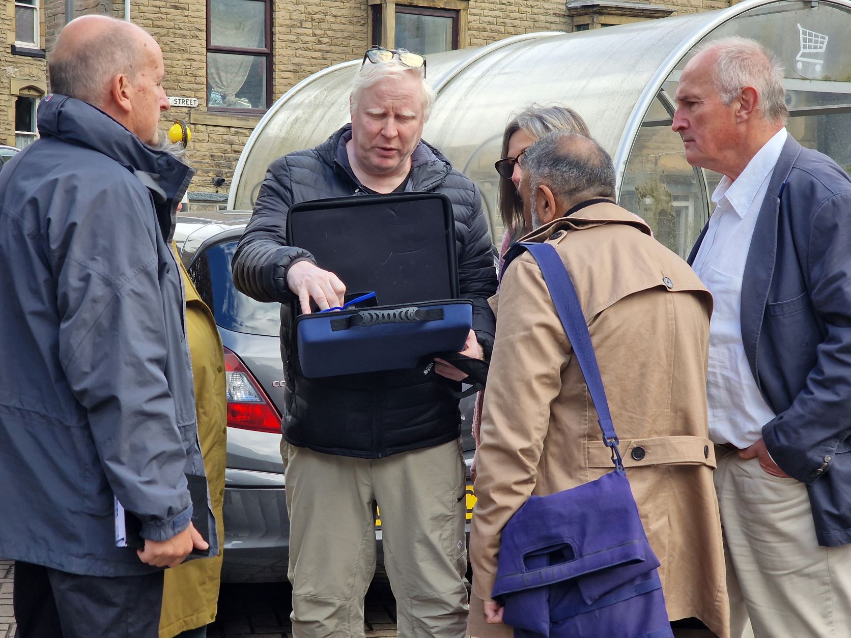 Senior Engagement Manager Iain Mitchell distributing simulation spectacles to everyone taking part in the walk.