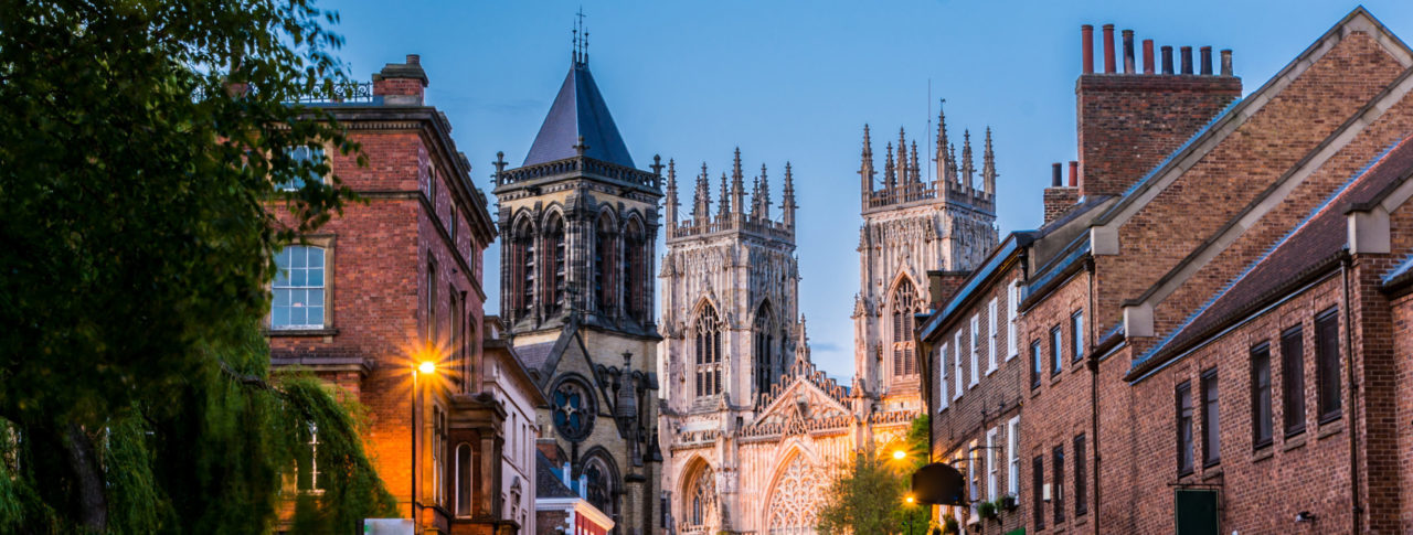 York Sight Loss Council image showing city streets at dusk with York Minster in the background