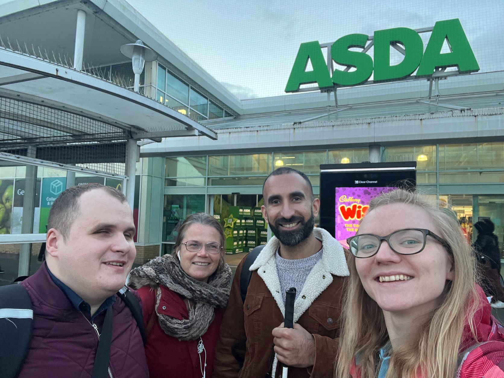 London SLC outside ASDA Wembley. From left to right, Hubert, Tech Team Intern at TPT, Vicky and Davinder, London SLC members, and Lucy Williams, Senior Manager for the South.