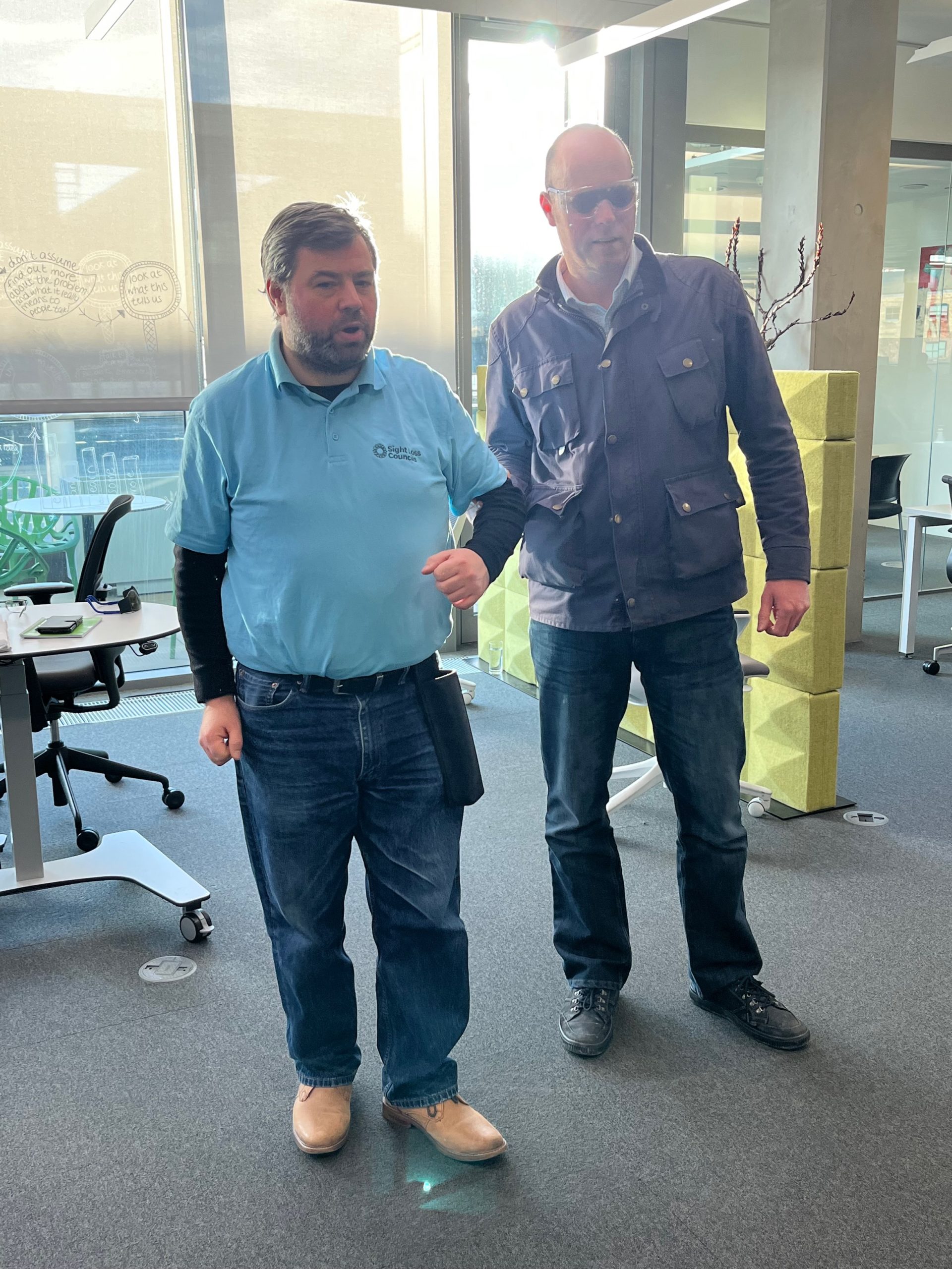 Image shows Steve Reed, London SLC, standing with Richard from thr Transport Design Team. Richard is holding Steve's elbow.