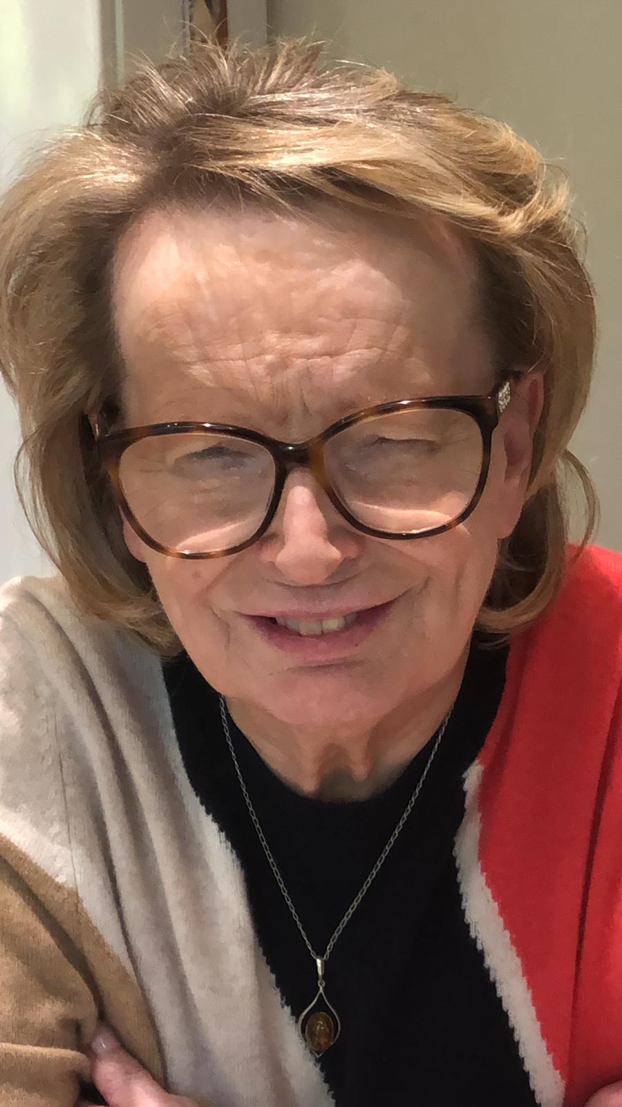 Image shows Birmingham SLC member, Val Griffiths, looking at the camera, smiling. She has light brown hair and is wearing glasses.