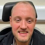 Headshot of Brendan Ferrell, Merseyside SLC member. He has fair hair and a beard, and is smiling at the camera.