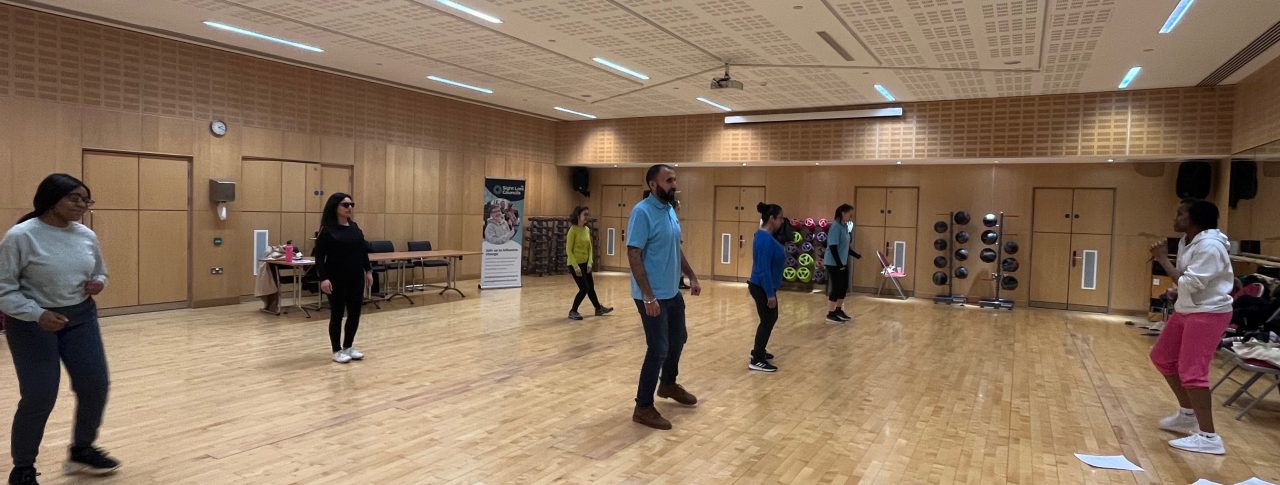 Attendees at the Access Gym's event, participating in the VI Zumba session in a dance studio at Better Gym.