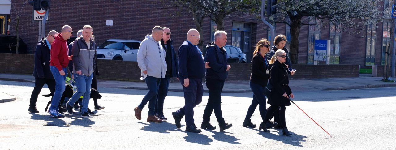 Members of Merseyside Sight Loss Council pictured during the sim spec walk with Sefton Council staff members. Kelly Barton, Engagement Manager for the North West is leading the walk with her pink cane.