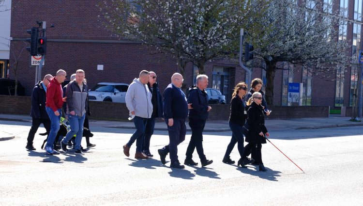 Members of Merseyside Sight Loss Council pictured during the sim spec walk with Sefton Council staff members. Kelly Barton, Engagement Manager for the North West is leading the walk with her pink cane.