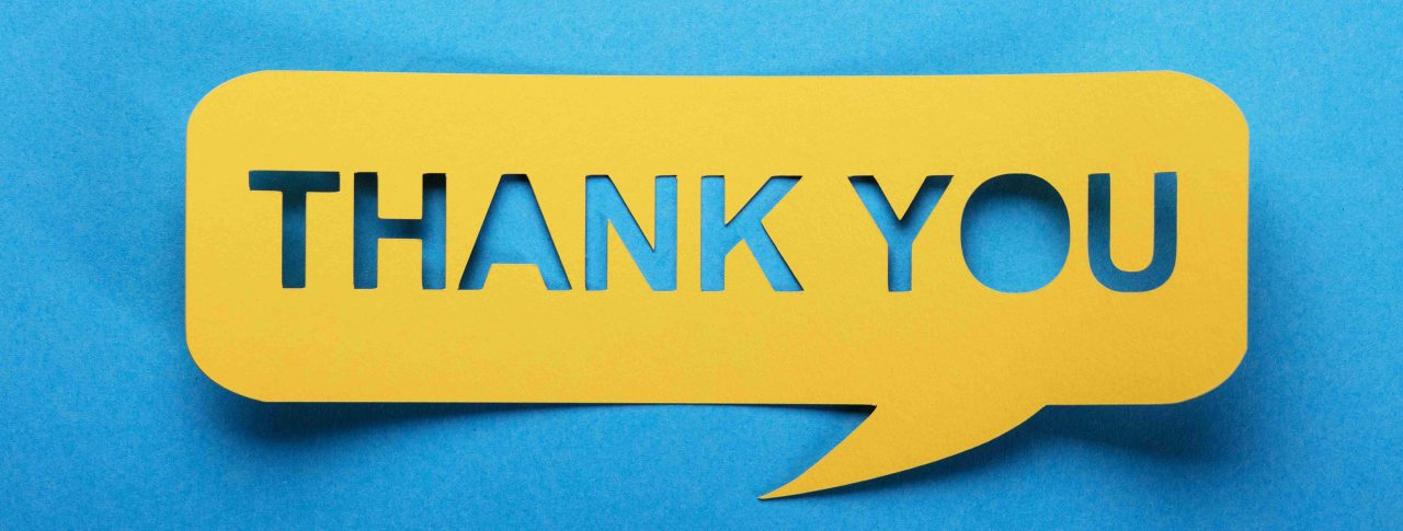 Thank you text in a yellow speech bubble, against a light blue background.