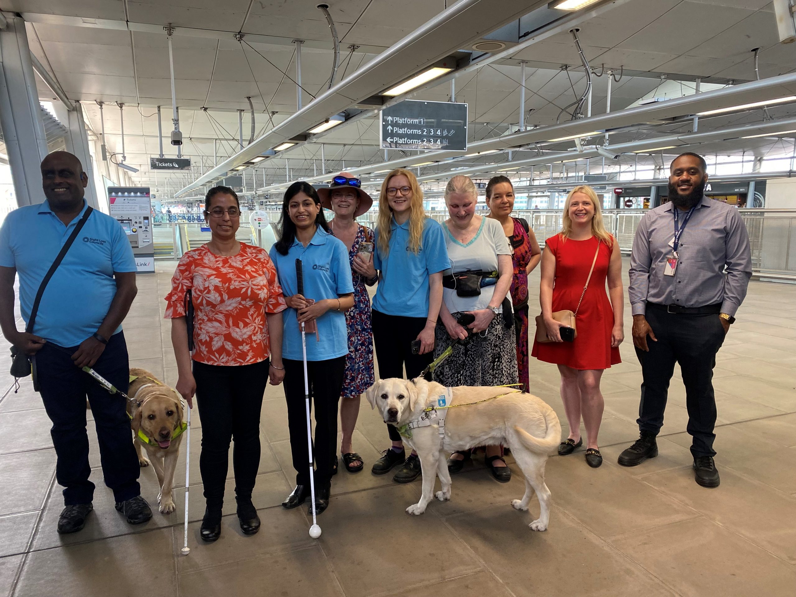 Members of London and SW London SLCs standing in the concourse by the platforms at London Blackfriars. From left to right: Haren, Amrit, Vidya, Vicky, Engagement Manager, Lucy Williams, SLC member Mary, Denise, Sophie, Accessibility Improvement Manager for GTR, and the Blackfriars Station Manager.