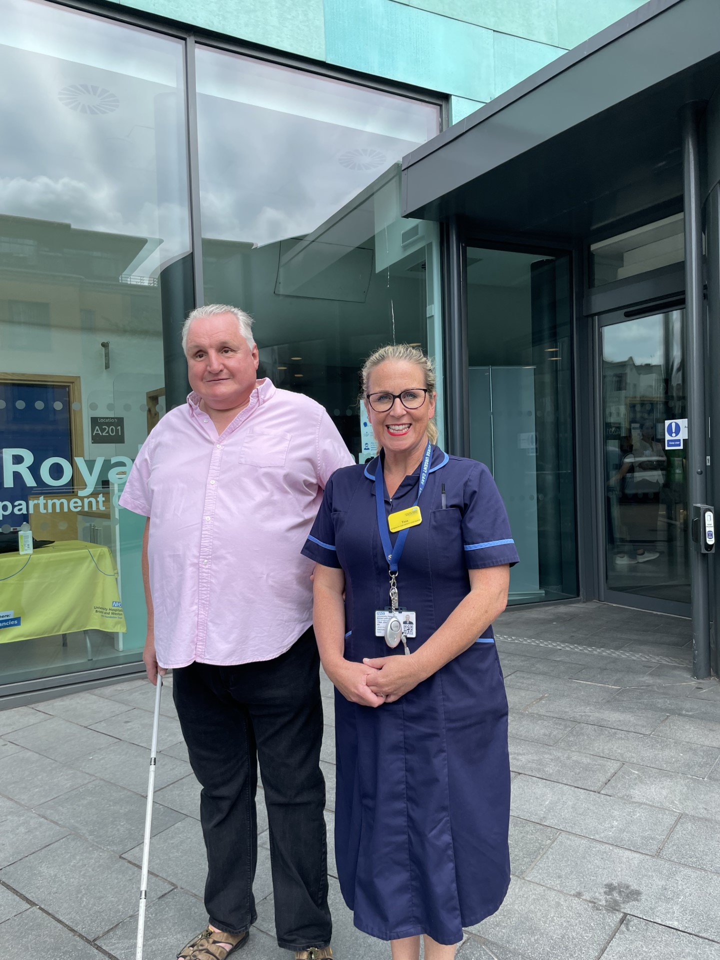 Alun Davies, Engagement Manager for South West England, stood with Tina Johnson, Lead nurse for the BRI Emergency Department and the Medical Assessment zone. They are stood outside the entrance to the emergency department.