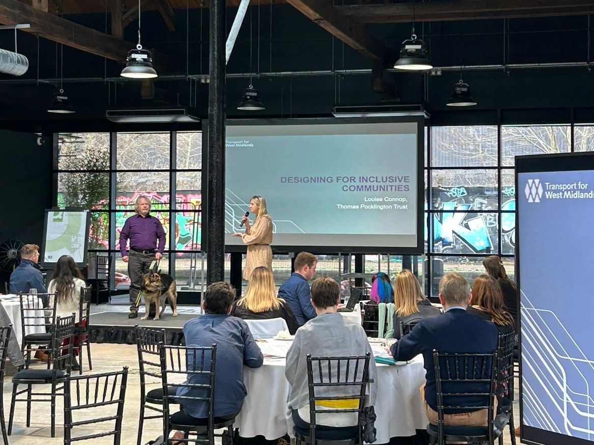 Birmingham SLC member, Steve Keith, on stage with Senior Engagement Manager for Central England, Louise Connop. They are stood on stage, presenting at a West Midlands Combined Authority event.