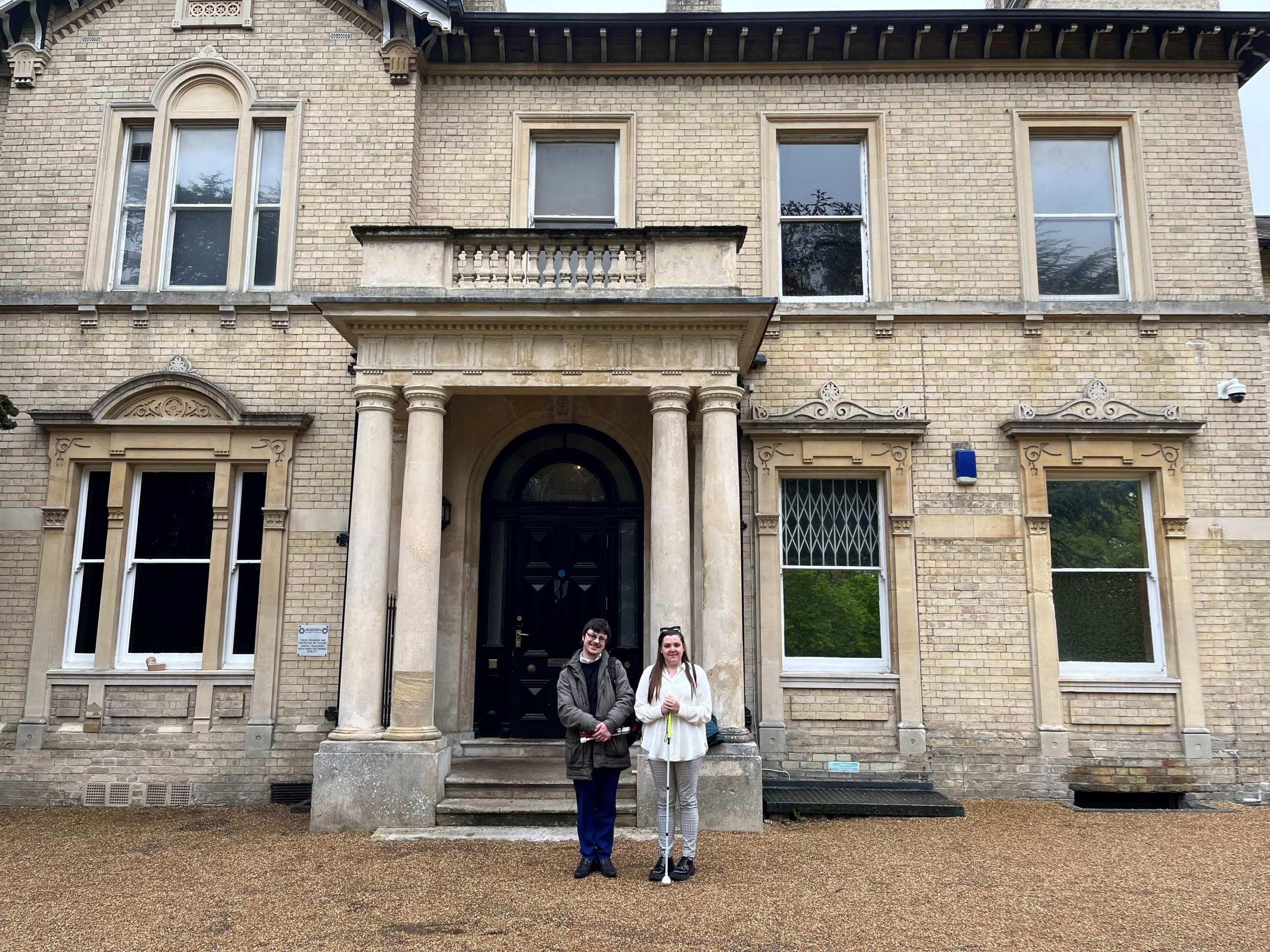 Alex, Essex SLC member, with Samantha Leftwich, Engagement Manager for East England. They are standing outside Chelmsford Museum, smiling at the camera.