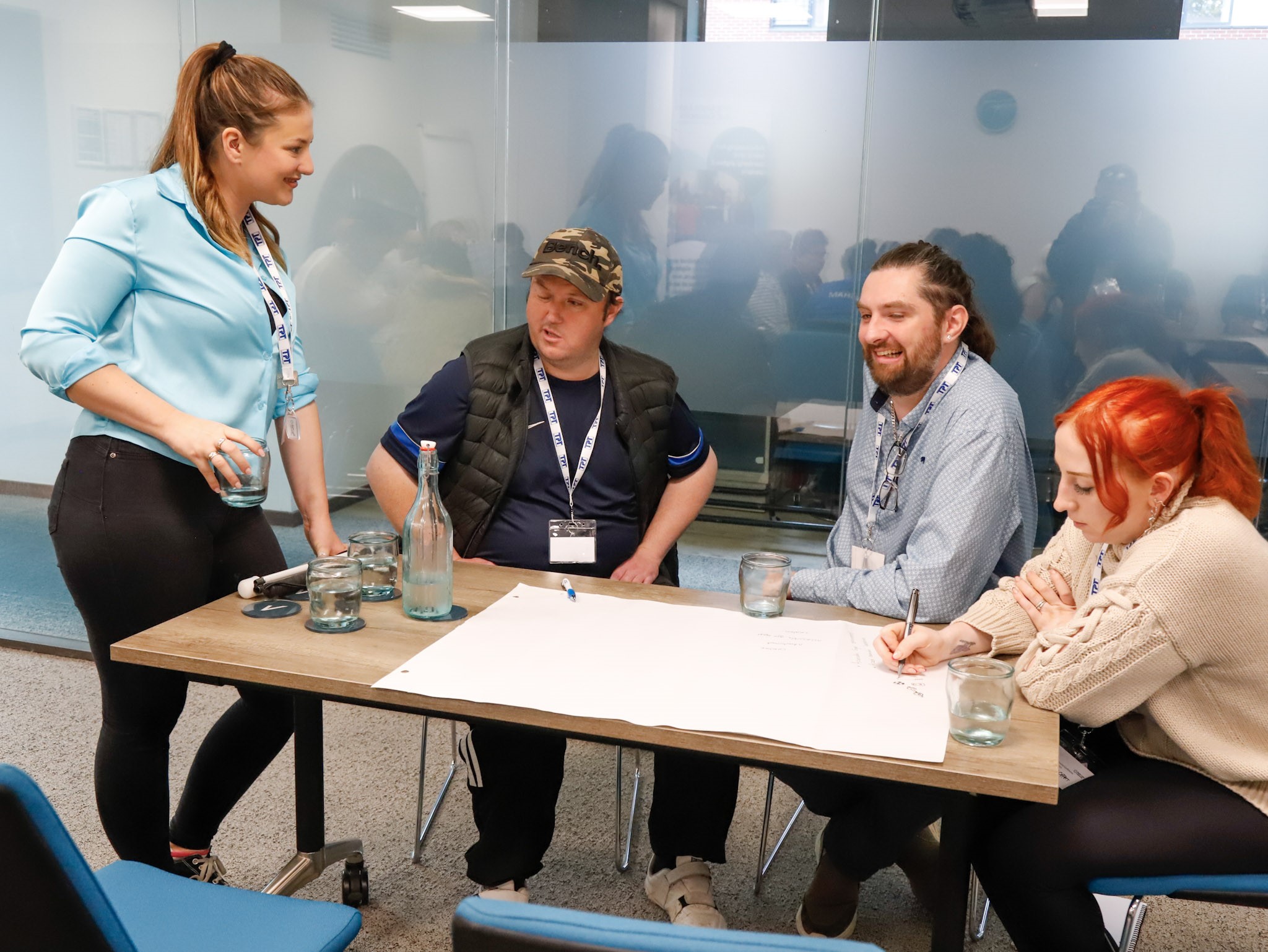 Belle Whitely, SLC coordinator for Yorkshire and Humberside, pictured talking to Matty Bolam, SLC member, jack Moffat, Engagement Manager for the north east, and Becky, a support worker who is taking notes, during the sports project session.