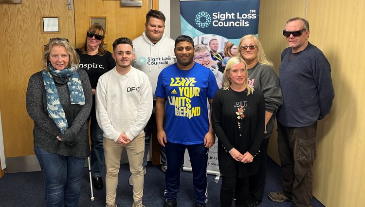 Lancashire Sight Loss Council members, Alison, Lynne, Lloyd, Mohammed Salim, Dawn, and Michael, pictured in front of the Sight Loss Council banner, with David Parfett, SLC coordinator for North West, and Kelly Barton, Engagement Manager for the North West.