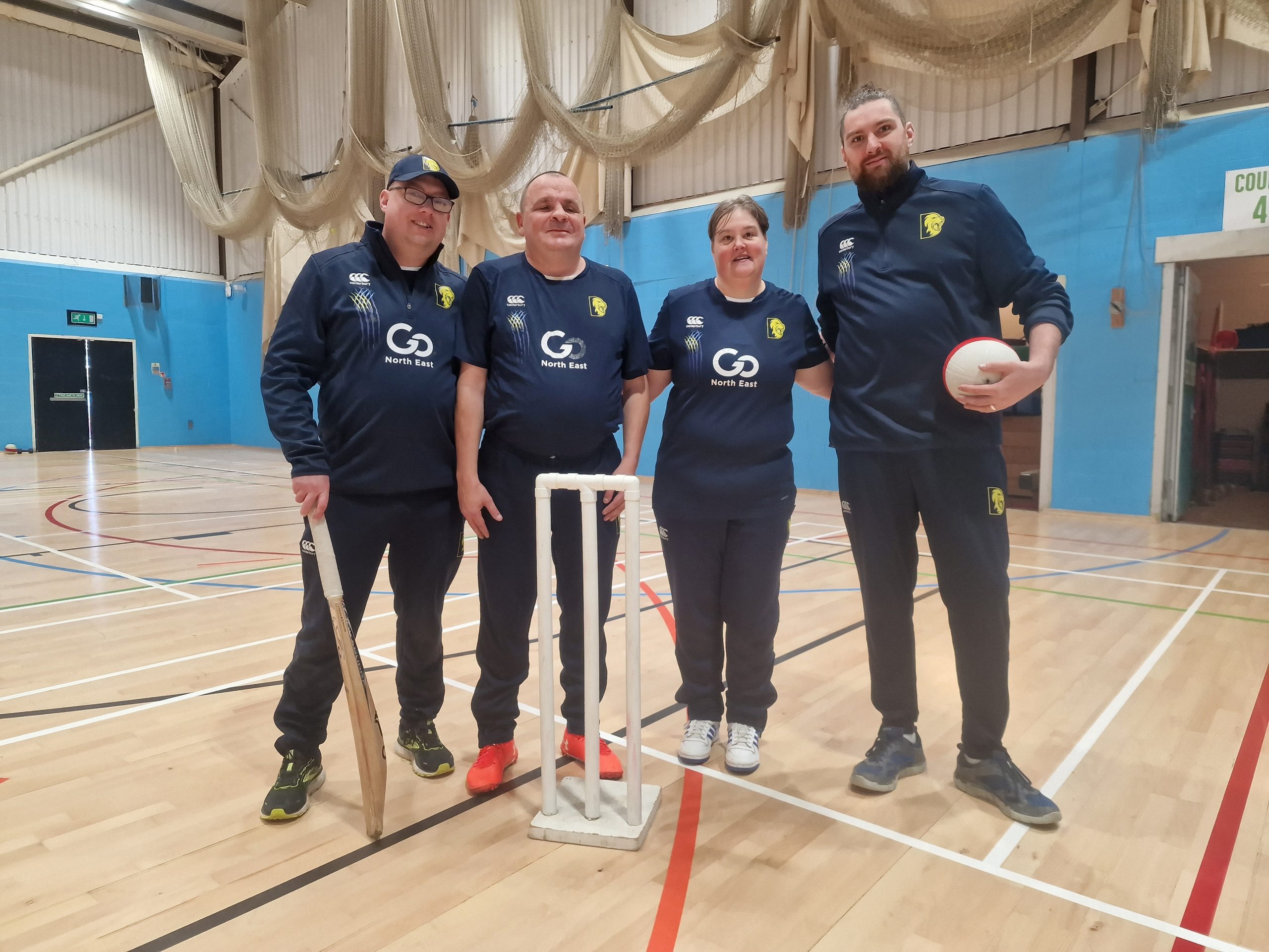 Durham VI Cricket team coaches and players. From left to right: Chris Ashburn, Darren Cook, Emma Gilfoyle, and Jack Moffat.