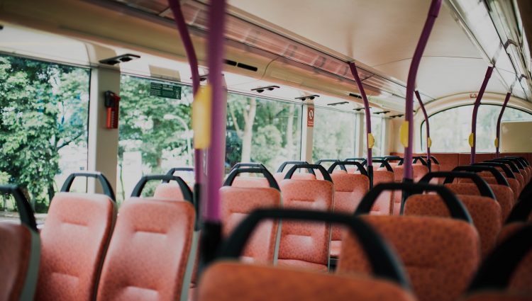 The empty upper deck of a bus